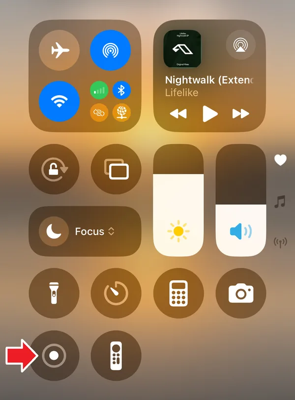 iOS Control Center with a red arrow pointing at the Screen Recording button
